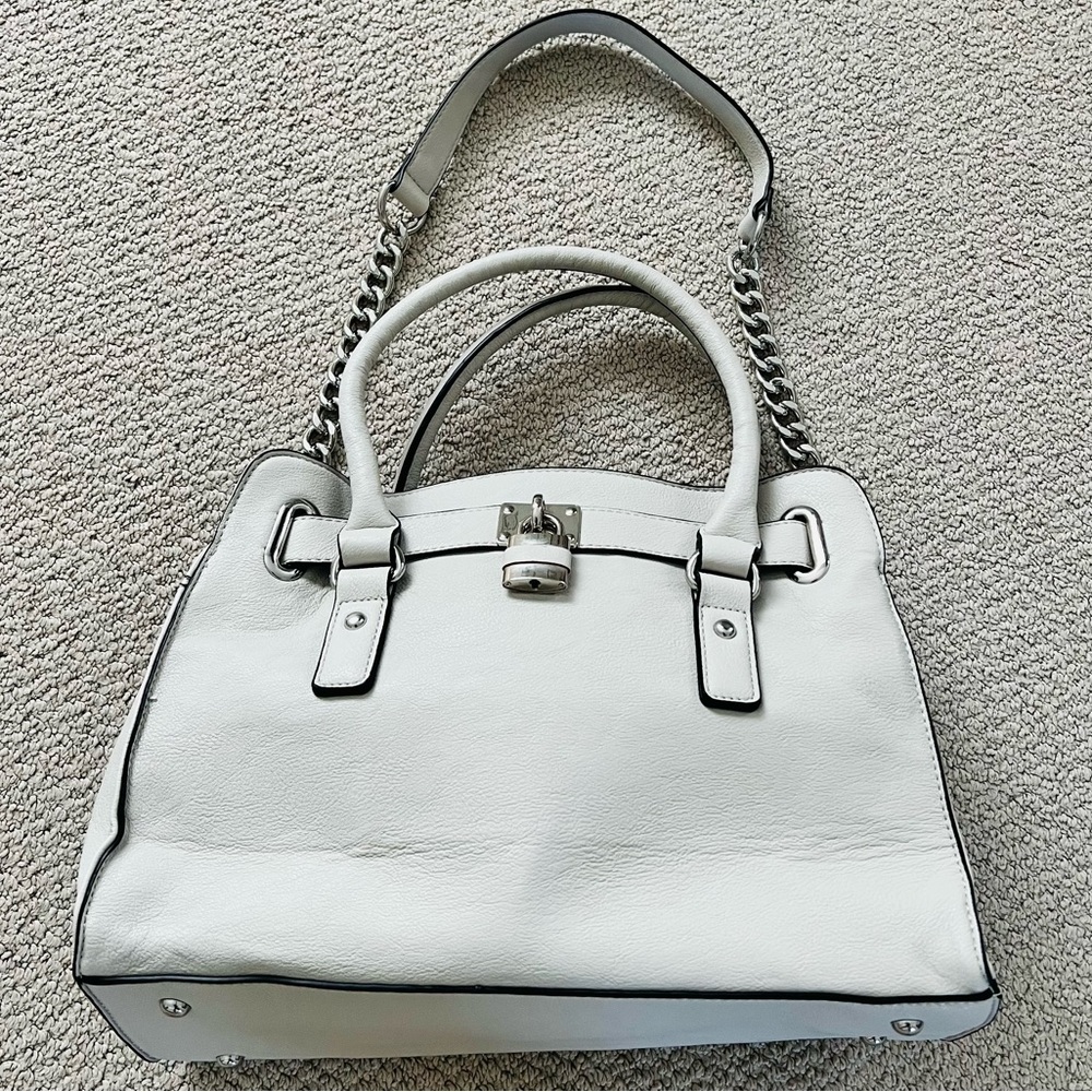 Charming Charlie light grey vegan leather purse with silver lock and accents